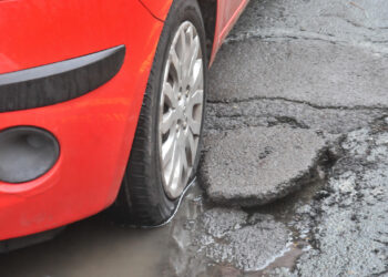 Cars damaged by Potholes