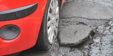 Cars damaged by Potholes