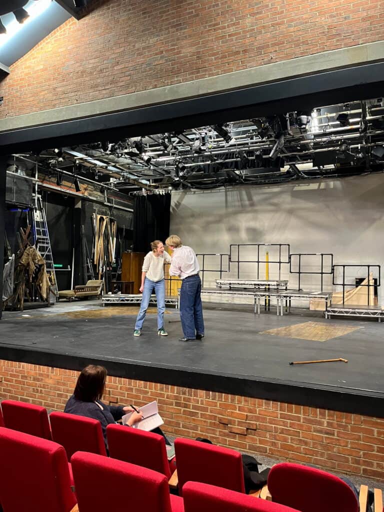 Two actors rehearsing a scene from Frankenstein on stage at Wokingham Youth Theatre.
