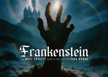 Hand reaching towards lightning with castle in background for Frankenstein play.